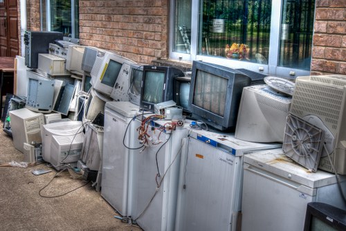 Professional waste clearance team managing construction debris